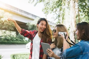 Group of Asian women using camera make photo while traveling at Bankok