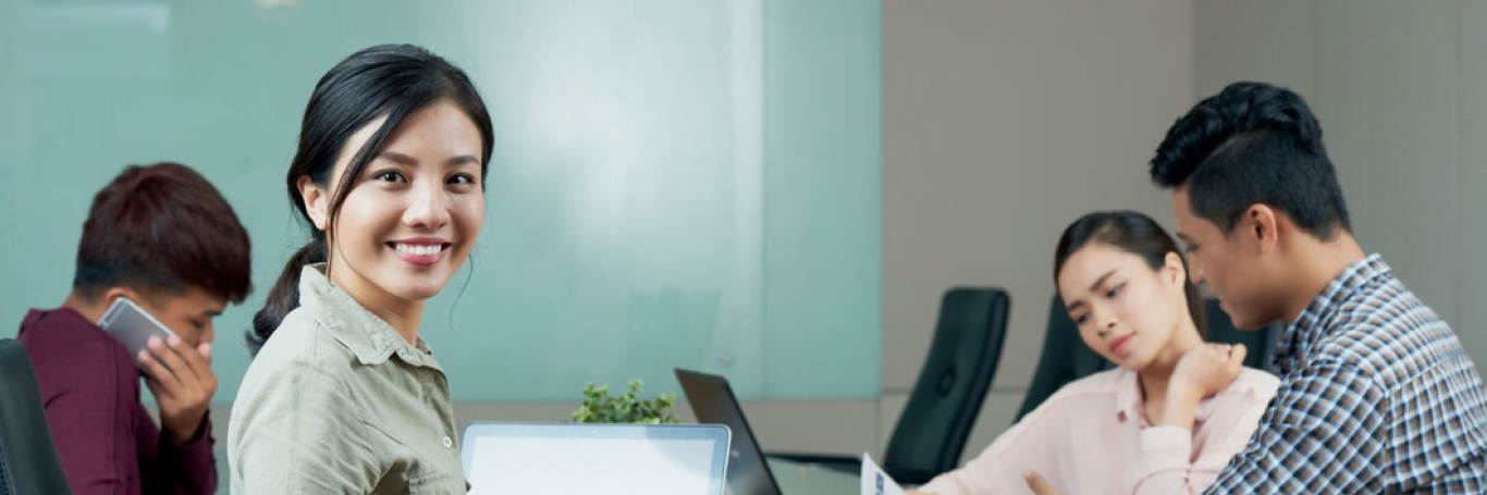 smiling woman in a meeting group